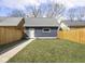 Exterior view of a detached garage with a well-kept lawn at 1838 Alabama St, Indianapolis, IN 46202
