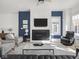 Contemporary living room with fireplace, hardwood floors, and plenty of natural light at 1838 Alabama St, Indianapolis, IN 46202