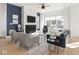 Inviting living room with a fireplace, ample seating, and a large window at 1838 Alabama St, Indianapolis, IN 46202