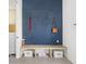 Cozy mudroom featuring a built-in bench with cubbies and a geometric patterned accent wall at 1838 Alabama St, Indianapolis, IN 46202