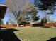 A spacious backyard features a privacy fence and mature trees offering a private outdoor space at 204 W Pullman St, Waldron, IN 46182