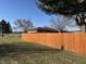 Spacious backyard with a wooden fence at 204 W Pullman St, Waldron, IN 46182