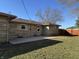 An inviting backyard with a concrete patio area provides space for outdoor entertaining at 204 W Pullman St, Waldron, IN 46182