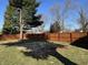Backyard includes a privacy fence and mature trees providing a private outdoor space at 204 W Pullman St, Waldron, IN 46182