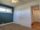 Bedroom featuring neutral carpet, a closet, two-tone walls, and a window at 204 W Pullman St, Waldron, IN 46182