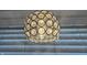 Modern chandelier with jeweled sphere as the focal point at 204 W Pullman St, Waldron, IN 46182