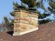 Close-up of a chimney made with light stone at 204 W Pullman St, Waldron, IN 46182