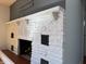 Elegant fireplace with white stone texture, corbels, and a decorative mantel at 204 W Pullman St, Waldron, IN 46182