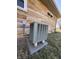 Exterior shot of HVAC system on stone base at 204 W Pullman St, Waldron, IN 46182