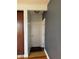 Hallway and doorway featuring gray walls, overhead lighting and hardwood floors at 204 W Pullman St, Waldron, IN 46182