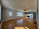 Inviting living room with hardwood floors, fireplace, and windows with view of exterior at 204 W Pullman St, Waldron, IN 46182