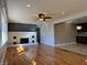The living room features hardwood floors, a fireplace, and natural light at 204 W Pullman St, Waldron, IN 46182