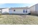Backyard featuring a grass area and partial view of the house at 3026 Everbloom Way, Indianapolis, IN 46217