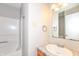 Bathroom with single sink vanity, mirror, and shower-tub combo at 3026 Everbloom Way, Indianapolis, IN 46217