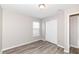 Bright bedroom features a window and a closet with sliding doors at 3026 Everbloom Way, Indianapolis, IN 46217