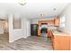 Modern kitchen with stainless steel appliances, wood cabinets and wood-look flooring at 3026 Everbloom Way, Indianapolis, IN 46217