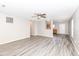 Bright living room featuring neutral walls, and durable wood-look flooring at 3026 Everbloom Way, Indianapolis, IN 46217