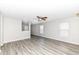 Open living room featuring wood-look floors, neutral paint and ample natural light at 3026 Everbloom Way, Indianapolis, IN 46217