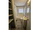This bathroom features a tub with shower and a sink with cabinet at 3044 Manor Ct, Indianapolis, IN 46218
