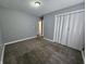 The bedroom includes a closet, gray walls, and carpet at 3044 Manor Ct, Indianapolis, IN 46218