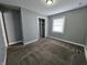 The bedroom includes a window, closet, and gray walls at 3044 Manor Ct, Indianapolis, IN 46218