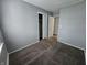 The bedroom includes a closet, gray walls, and carpet at 3044 Manor Ct, Indianapolis, IN 46218