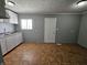 The kitchen includes white cabinets and a tiled floor at 3044 Manor Ct, Indianapolis, IN 46218