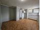 The kitchen includes white cabinets and a tiled floor at 3044 Manor Ct, Indianapolis, IN 46218