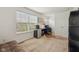 Bright bedroom with a sleeper sofa featuring an office area with a desk and a mini fridge at 3052 Skylar Ln, Indianapolis, IN 46208