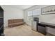 Bedroom with a sleeper sofa, mini fridge and desk with neutral colored carpet and white walls at 3052 Skylar Ln, Indianapolis, IN 46208