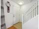 Bright entryway featuring hardwood floors, stairs to the second floor, and a neutral color palette at 3052 Skylar Ln, Indianapolis, IN 46208