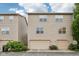 Charming townhouse with neutral siding, double-hung windows and attached one-car garage at 3052 Skylar Ln, Indianapolis, IN 46208