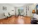 Inviting living room with hardwood floors, a large arched window, and stylish seating at 3052 Skylar Ln, Indianapolis, IN 46208
