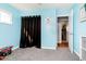 Bedroom with grey carpet and blue accent wall at 348 W Stop 11 Rd, Indianapolis, IN 46217