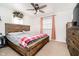 Bedroom with wood frame bed, carpet and natural light at 348 W Stop 11 Rd, Indianapolis, IN 46217