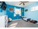 Bright room with blue accent wall, natural light and carpet at 348 W Stop 11 Rd, Indianapolis, IN 46217