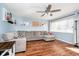 Bright living room featuring hardwood floors, a large sectional sofa, and natural lighting at 348 W Stop 11 Rd, Indianapolis, IN 46217