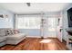 Cozy living room featuring hardwood floors, a comfortable sofa, and natural light streaming through the windows at 348 W Stop 11 Rd, Indianapolis, IN 46217