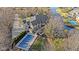 Aerial view of house showing the back porch, pool, and channel in the backyard at 3608 Olive Branch Rd, Greenwood, IN 46143