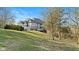 Beautiful backyard featuring a well-maintained lawn, mature trees, and a charming multi-story house at 3608 Olive Branch Rd, Greenwood, IN 46143