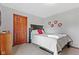 Neutral colored bedroom with gray walls, black bed frame and carpeted floors at 3608 Olive Branch Rd, Greenwood, IN 46143