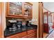 Butler's pantry with granite counters, upper cabinets, and coffee appliances at 3608 Olive Branch Rd, Greenwood, IN 46143