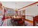 Formal dining room with hardwood floors, chandelier and large bay window at 3608 Olive Branch Rd, Greenwood, IN 46143