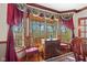 Dining room with bay window, custom window treatments and hardwood floors at 3608 Olive Branch Rd, Greenwood, IN 46143