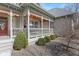 Spacious wrap-around porch with detailed trim, perfect for enjoying the outdoors at 3608 Olive Branch Rd, Greenwood, IN 46143