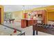 Large game room with a pool table, mini bar, and foosball table offers space for entertainment at 3608 Olive Branch Rd, Greenwood, IN 46143