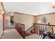 Open hallway with carpet, wooden railings, and decorative lighting at 3608 Olive Branch Rd, Greenwood, IN 46143