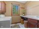 Laundry room with a utility sink, folding table and a window for natural light at 3608 Olive Branch Rd, Greenwood, IN 46143