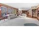 Open-concept living room with large windows, hardwood floors, and access to the kitchen at 3608 Olive Branch Rd, Greenwood, IN 46143