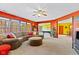 Open living room with large windows, recessed lights, and adjacent game room at 3608 Olive Branch Rd, Greenwood, IN 46143